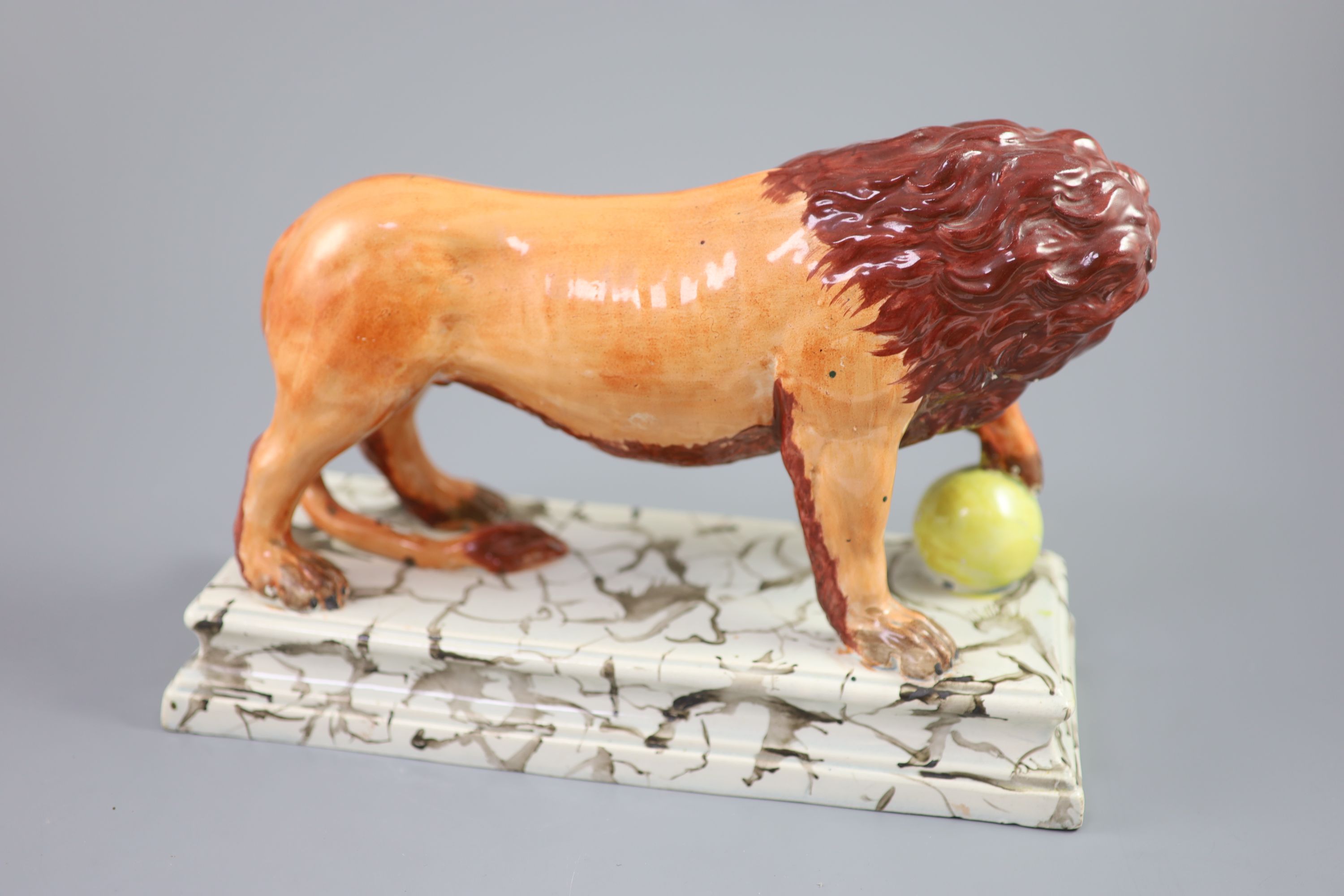 An Enoch Wood pearlware figure of a Medici Lion, c.1800-10, 28cm long